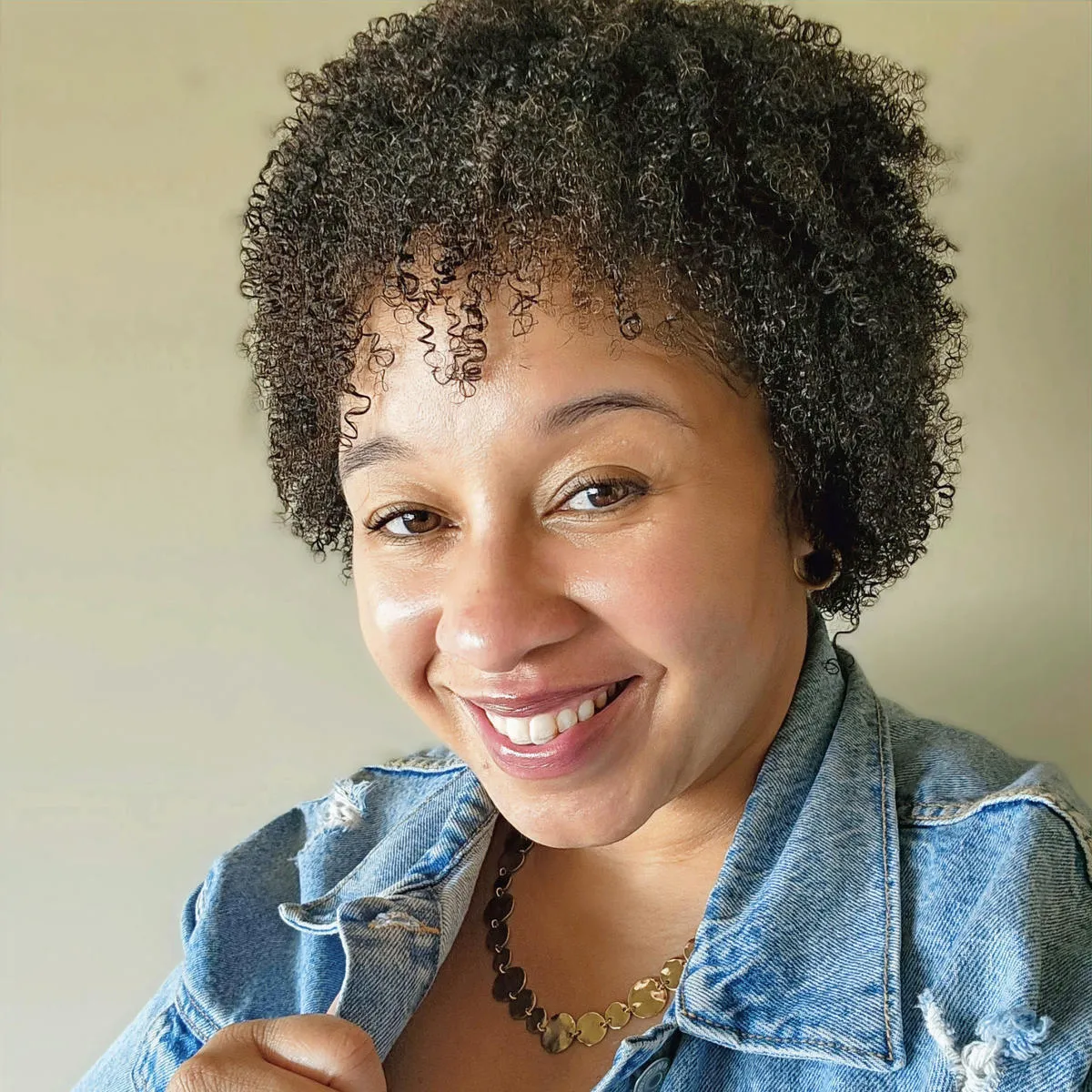 Tameko smiling warmly for a portrait
